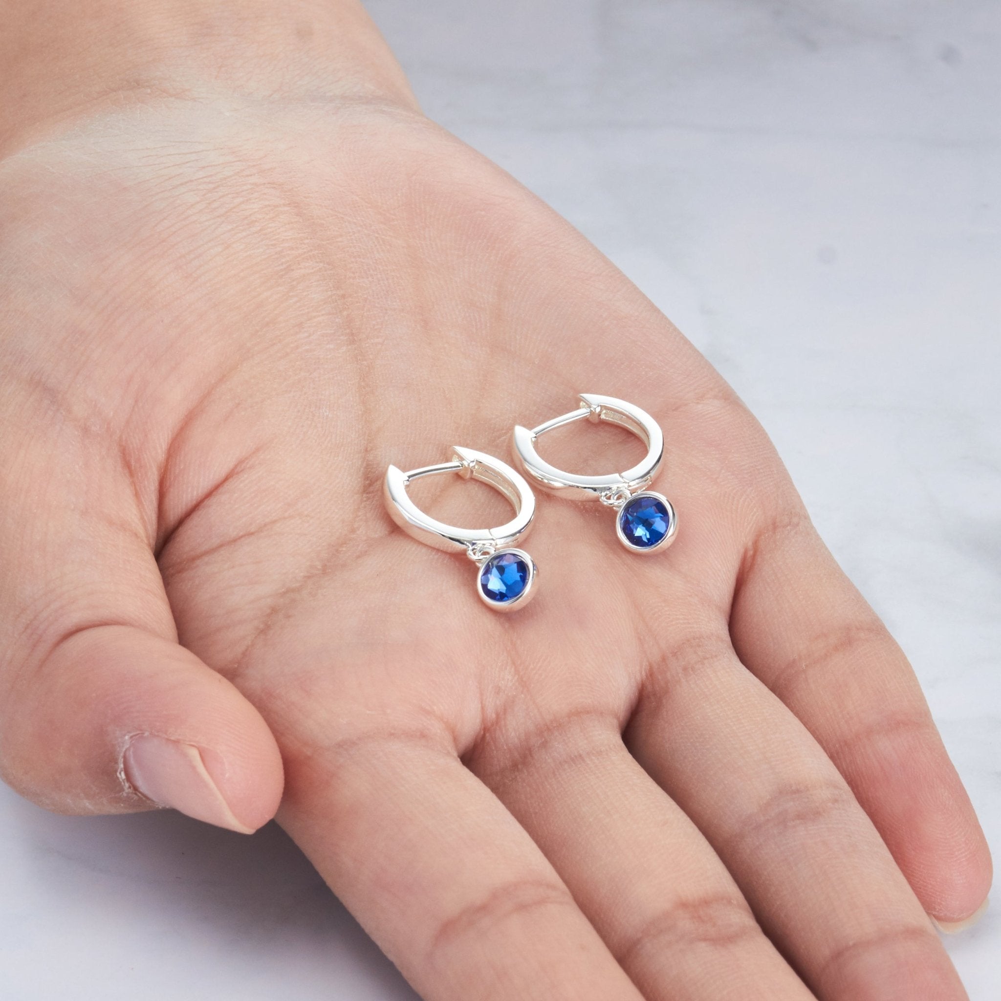 September Birthstone Hoop Earrings Created with Sapphire Zircondia® Crystals - Philip Jones Jewellery